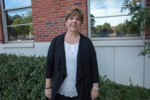 Dr. Collins outside the School of Education