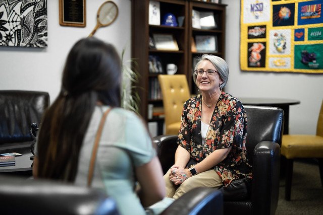 Stacey Martin enjoys a conversation with a student.