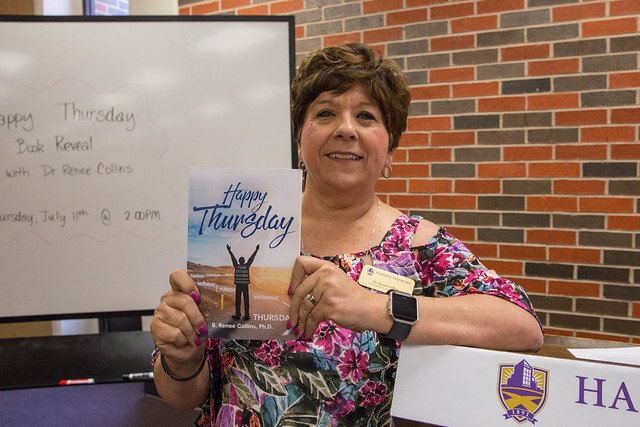 Dr. Collins holds "Happy Thursday" at Thursday's Book Reveal