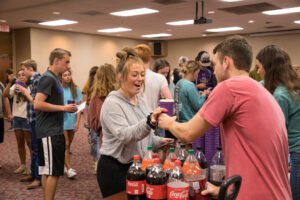 BSM Members serve floats at the Howdy Party