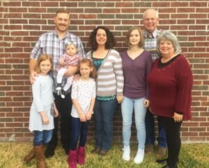 Mandy Cunningham with her husband, children, and parents.