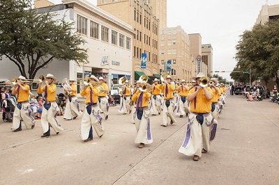 The World Famous Cowboy Band marching in a parade.