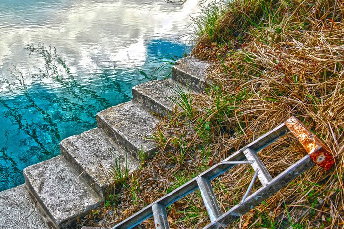 Photo for art show, by Tim Chandler, of concrete steps and water.