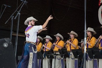 The World Famous Cowboy Band on stage performing.