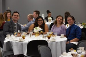 Students gather around for a group photo at the 2018 Etiquette Dinner.