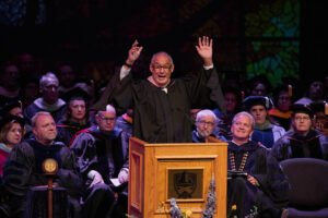 Randy Lewis speaks with high energy during Convocation at Behrens Auditorium.