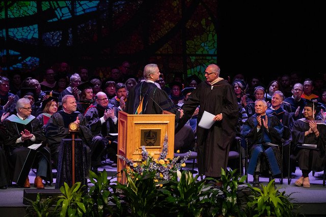 President Eric Bruntmyer shakes hands with guest speaker Randy Lewis.