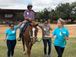 Patty Hanks students practice leading a horse.