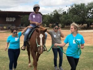 Patty Hanks students practice leading a horse. 