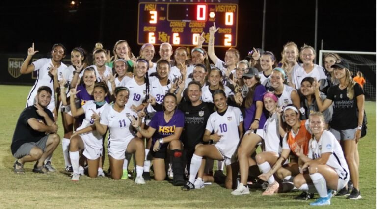 Coach Marcus Wood celebrates with the Cowgirls after his 350th win.