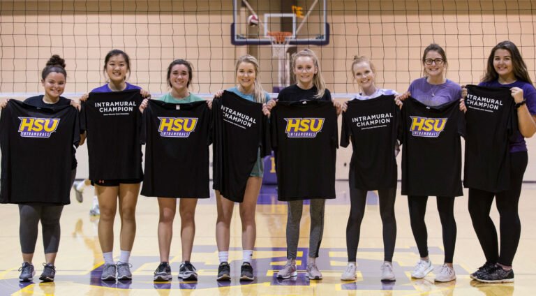 The winners of the 2018 Women’s Intramural Volleyball Championships receive their championship shirts.