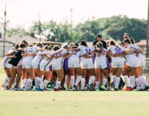 The HSU women’s soccer team huddles together before their game on Sept. 26, 2019.
