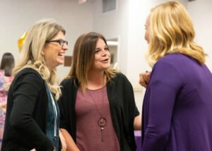 Members of the class of 1999 catch up at their reunion dinner.