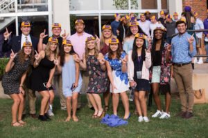A group of new students poses after receiving their beanies in 2017.