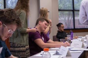 Delegates in the first Texas Crisis Simulation confer over world issues during a session in April 2019.