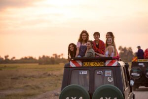 Members of the HSU cross-country team enjoy a safari excursion during their trip to Kenya in late June.