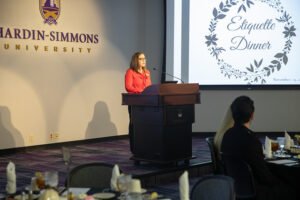 HSU Director of Career Services Alyssa Rasco introduces speaker Clairissa Tucker at the 2019 Etiquette Dinner.