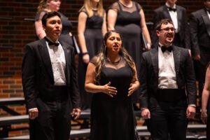 Students Aaron Dominguez, Janet Moreno, and Bryson Rule sing in the Fall Choral Showcase.