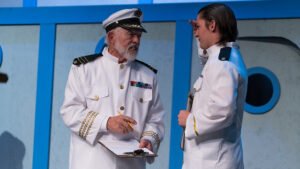 Larry Wheeler played the ship's captain in HSU's production of Anything Goes. Here, he gives orders to his second-in-command. during a performance.