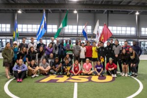 Students come together for a photo after the International Soccer match.