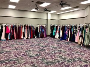 The donated dresses are put on display for the young ladies to browse and try on.