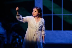 Senior Madeline Lowry portrays Mary Lennox during an eerie scene of The Secret Garden.