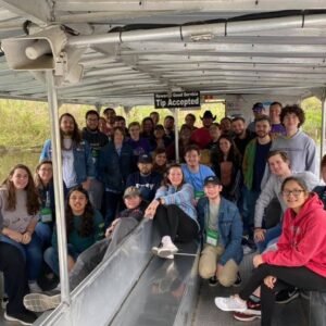 Students experience a Cajun Pride swamp boat tour of the bayou.