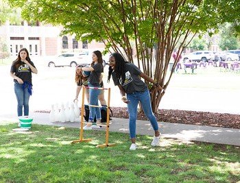 Students play frisbee at Cowboy Connect.