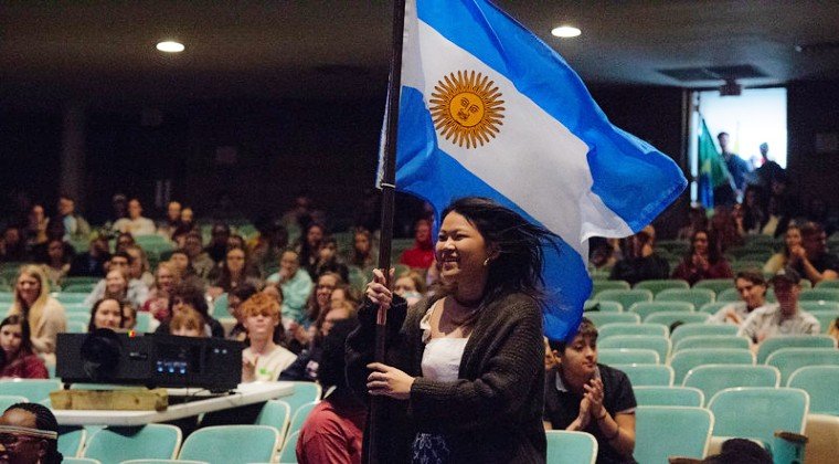 Student carries Argentine flag during International Week