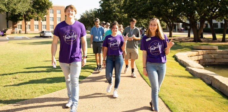 Admissions ambassadors lead a tour across campus.