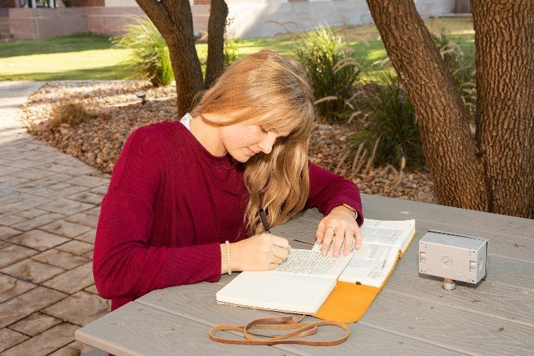 A student works on her homework.