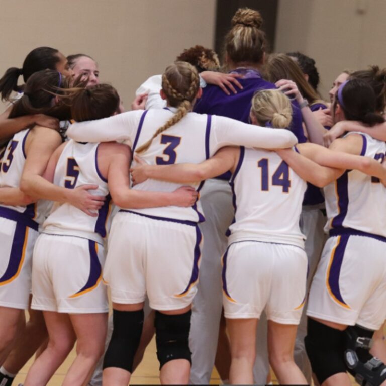 Cowgirl basketball players hug