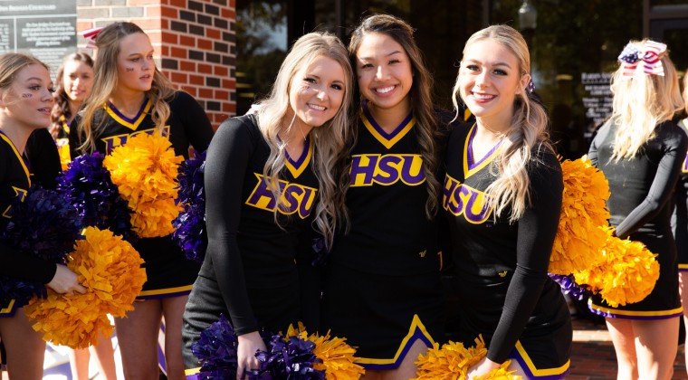 HSU cheerleaders in front of the library