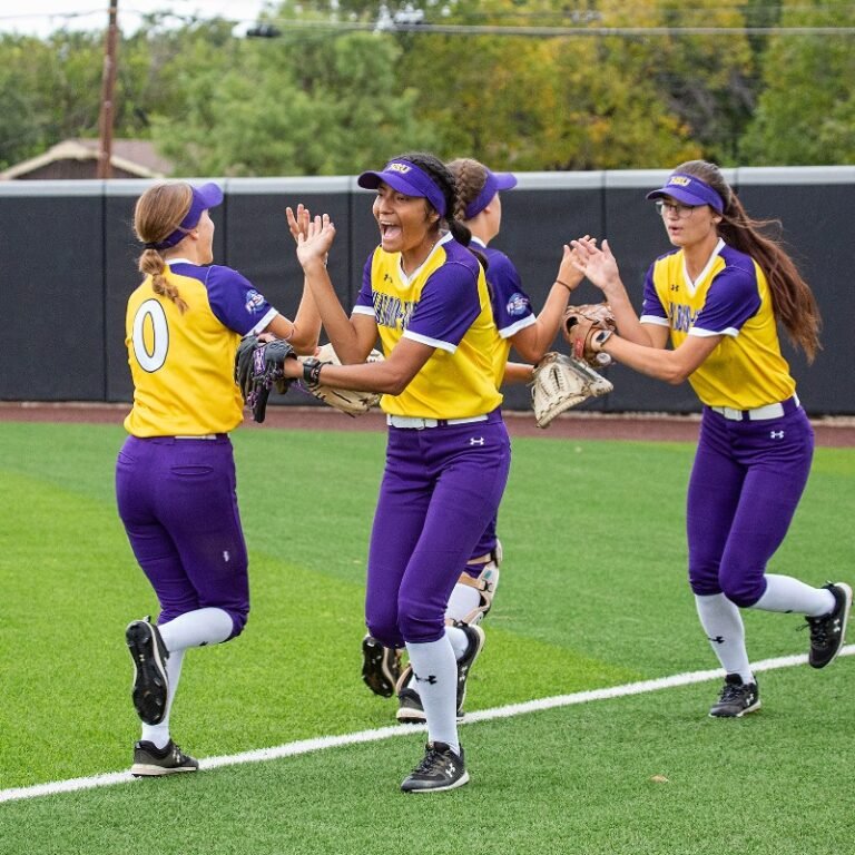 Softball players slap hands