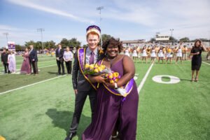 The 2022 University Homecoming King and Queen (Karson Gopffarth and Jailyn Woods-Mcgarthy) pose after being crowned.