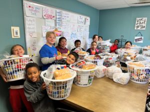 Ortiz E.S. Students enjoying their Thanksgiving baskets