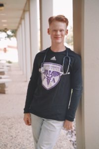 Karson Goppfarth donning his HSU PA school shirt and stethoscope.