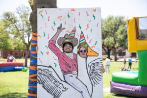 Students participated in a face-in-the-hole photo opportunity with Gilbert.