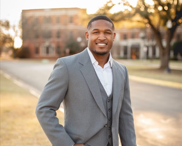 Givan Rhodes standing on campus.