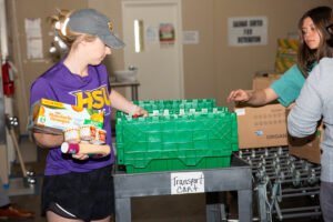 Volunteers sorting food at the food bank.