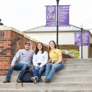 Students sitting on steps.