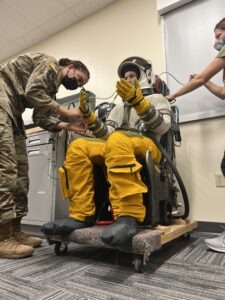 Alumna Jamie Talley '21 in a G-Suit fitting at Beale AFB.