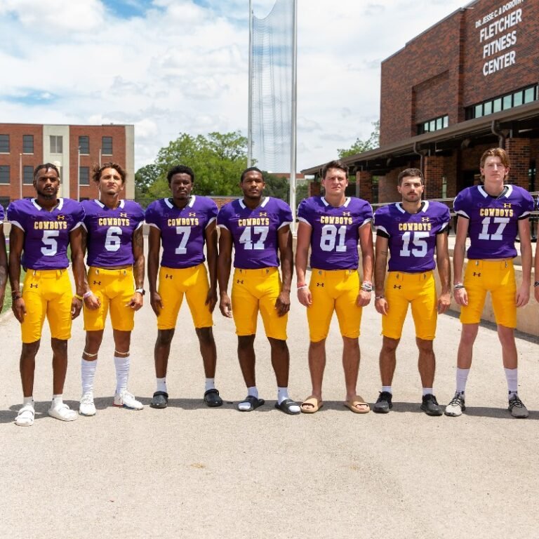 Members of the HSU football team pose for a photo.