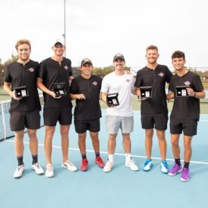 The HSU men's tennis team poses with awards.