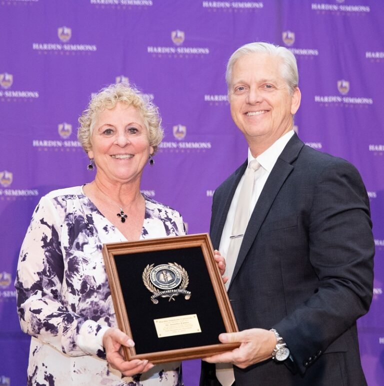 President Bruntmyer presents an award to Dr. O'Connell.