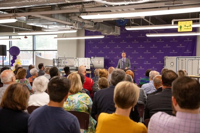 Dr. Matt Jackson speaks to a crowd of people at the dedication of Abilene Hall.