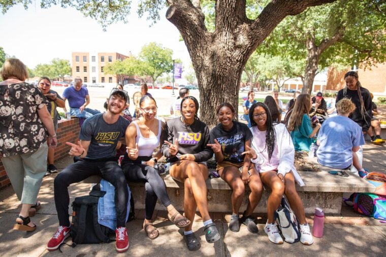 Students sit outside Newman-Richardson Science Center