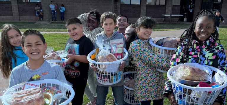 Ortiz E.S. Students enjoying their Thanksgiving baskets