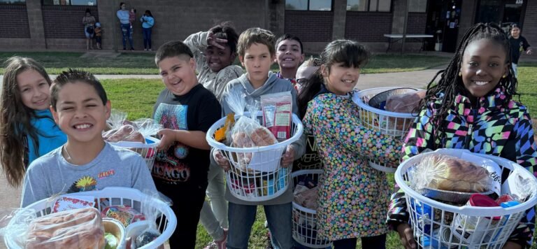 Ortiz E.S. Students enjoying their Thanksgiving baskets