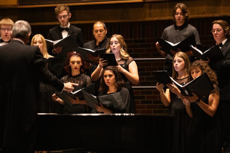 Dr. Romines directs the choir during an October 2023 concert.